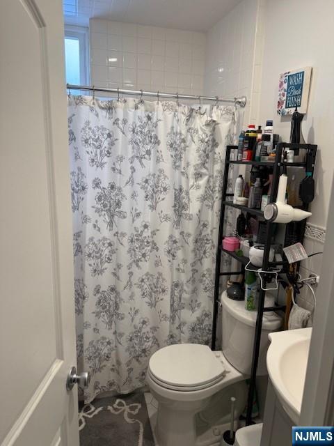 210 Hoboken Road, Unit 2A East Rutherford, NJ 07073 - Photo 15 of 15 a bathroom with a toilet and a shower