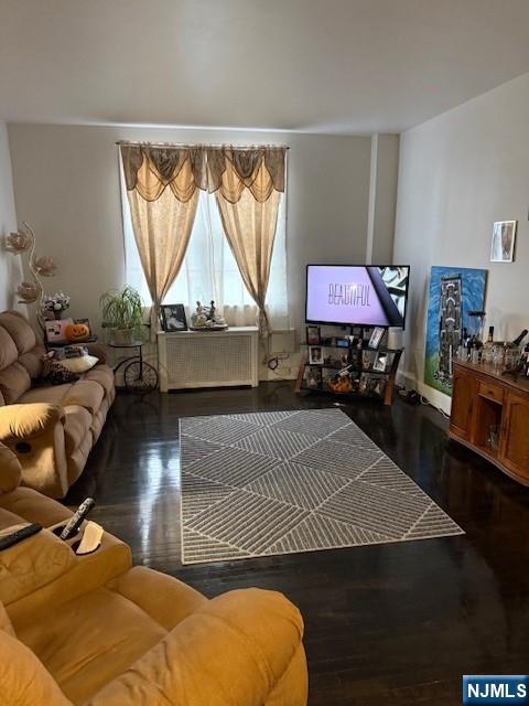 210 Hoboken Road, Unit 2A East Rutherford, NJ 07073 - Photo 3 of 15 a living room with furniture a window and a flat screen tv