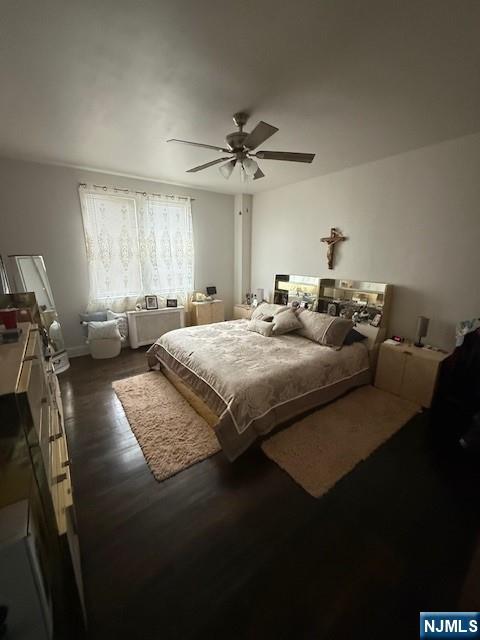 210 Hoboken Road, Unit 2A East Rutherford, NJ 07073 - Photo 4 of 15 a bedroom with a bed couches and a flat tv screen
