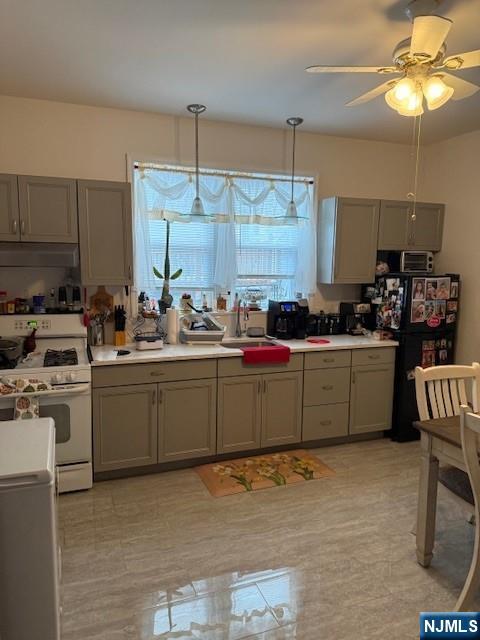 210 Hoboken Road, Unit 2A East Rutherford, NJ 07073 - Photo 8 of 15 a kitchen with cabinets a sink and white appliances