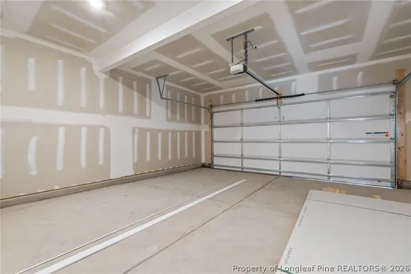 a view of a garage with racks on the wall