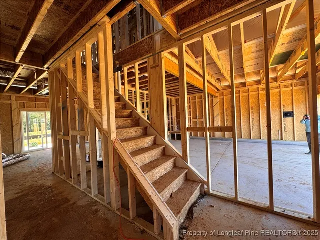 a view of entryway with a door and stairs