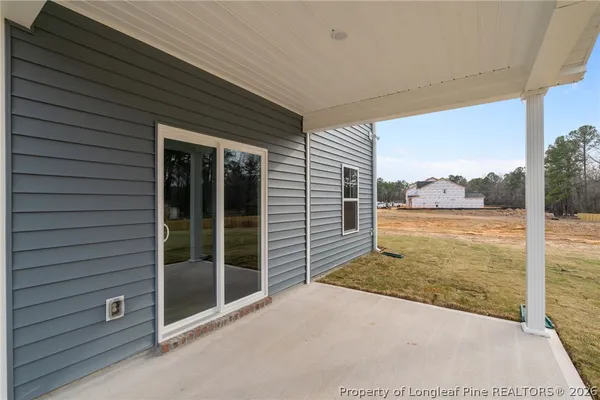 a view of swimming pool from a bathroom