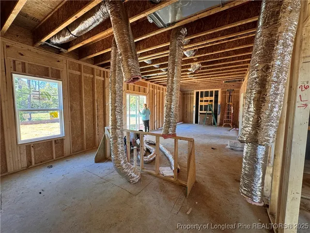 a view of an empty room with windows