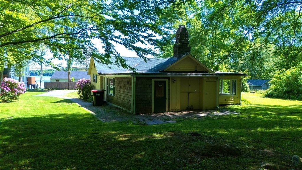 217-bb Tickle Road Westport, MA 02790 - Photo 10 of 24 a front view of a house with garden