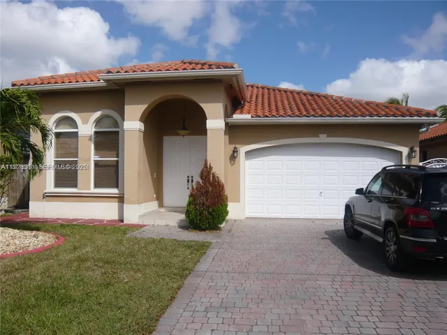 a house view with a garden space