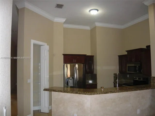 a view of entryway with livingroom