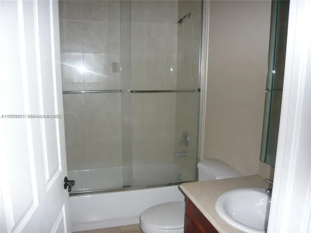 a bathroom with a sink and toilet