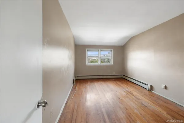 a view of room with furniture and windows