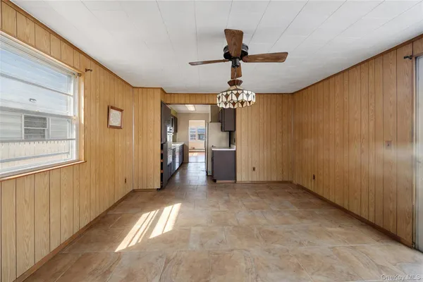 a kitchen with a sink and a refrigerator