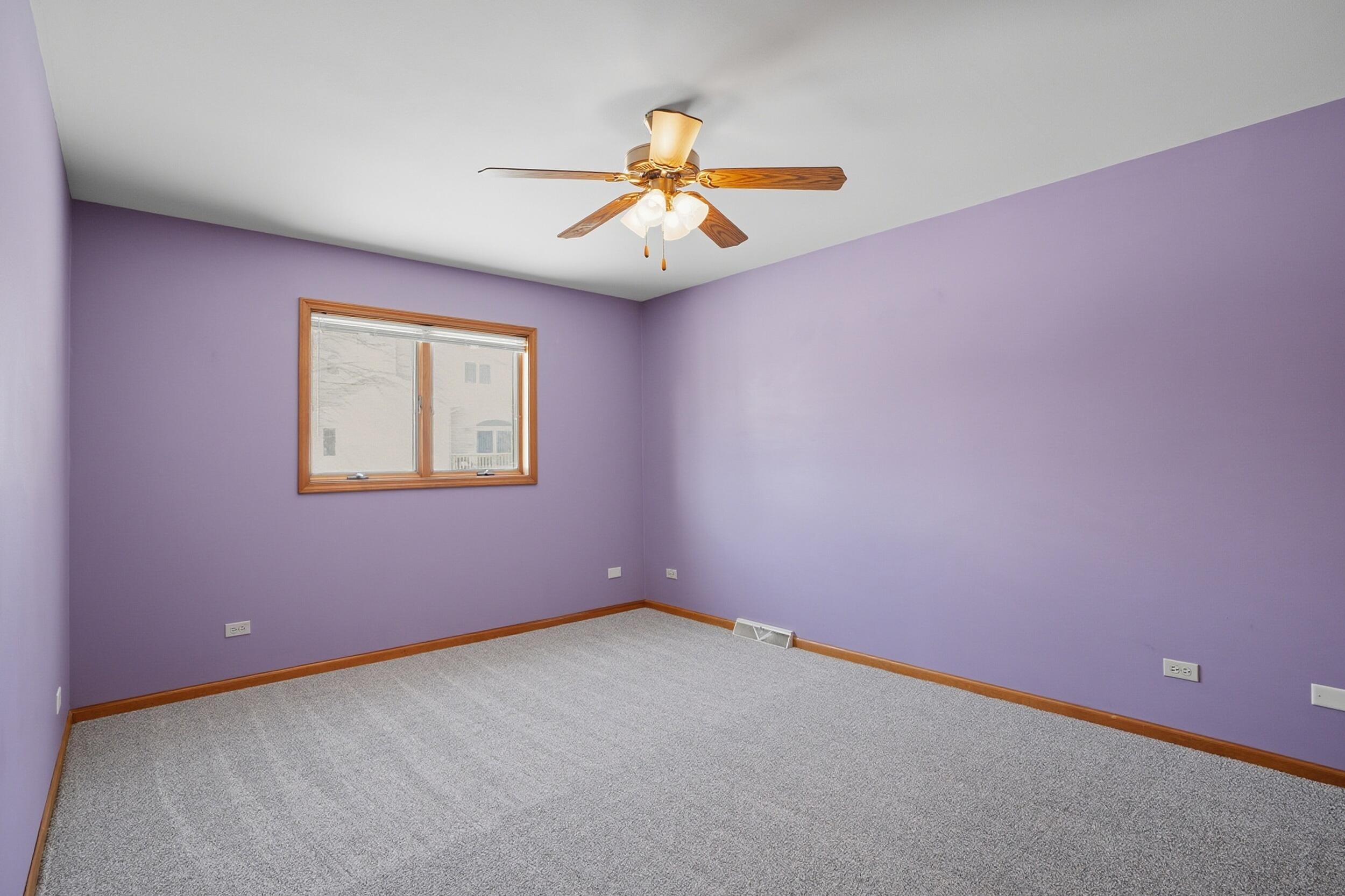 5125 Cardinal Court Schererville, IN 46375 - Photo 12 of 27 an empty room with windows and fan