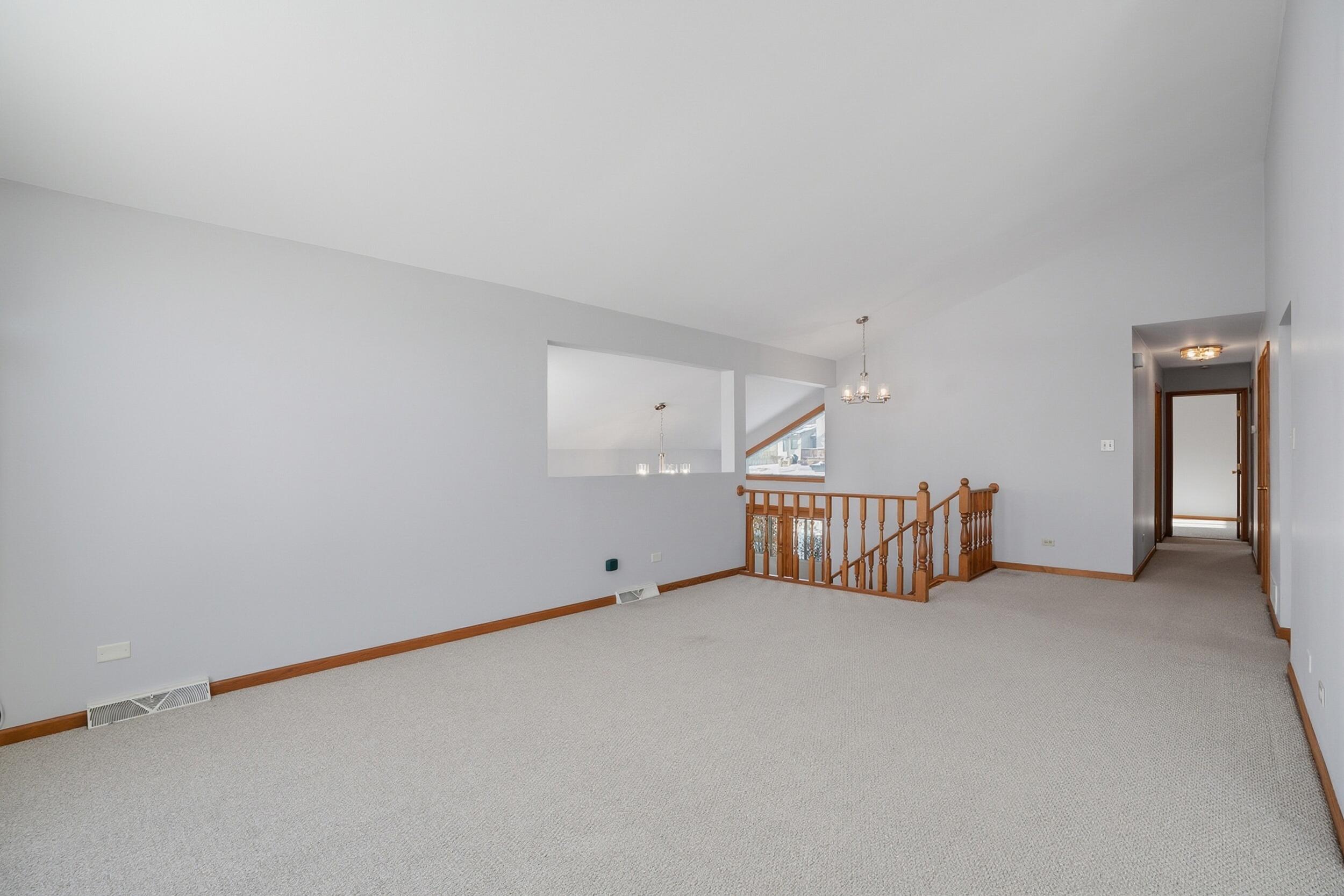 5125 Cardinal Court Schererville, IN 46375 - Photo 6 of 27 a view of an empty room with a projector