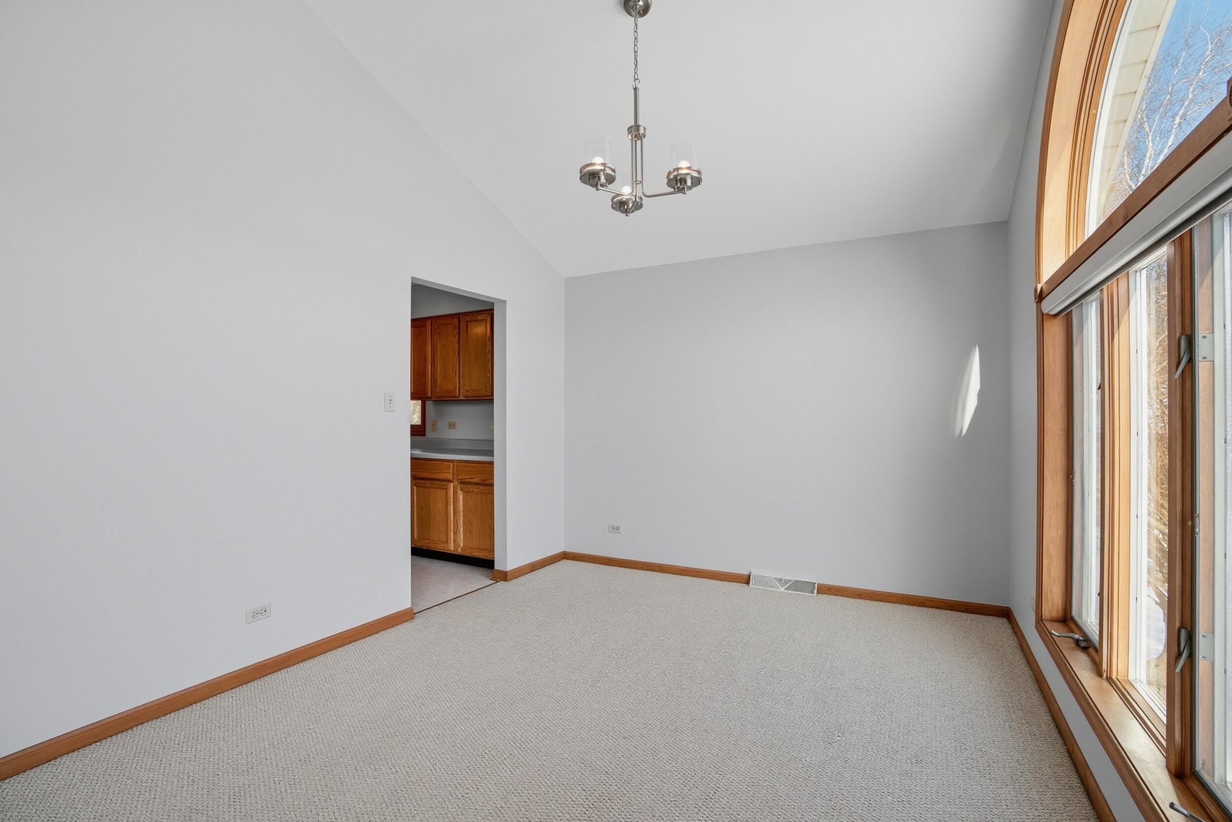 5125 Cardinal Court Schererville, IN 46375 - Photo 8 of 27 a view of an empty room with a window