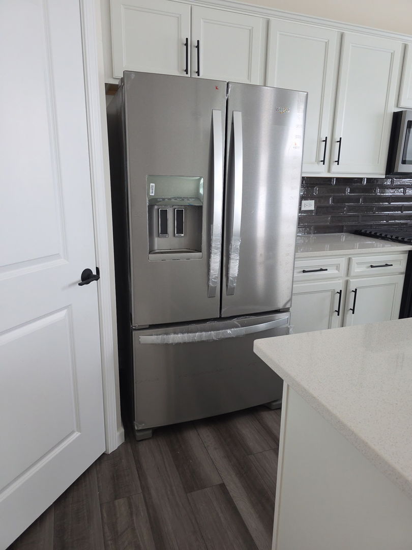 2240 Bent Grass Way Bolingbrook, IL 60490 - Photo 2 of 4 a kitchen with stainless steel appliances a refrigerator and a stove