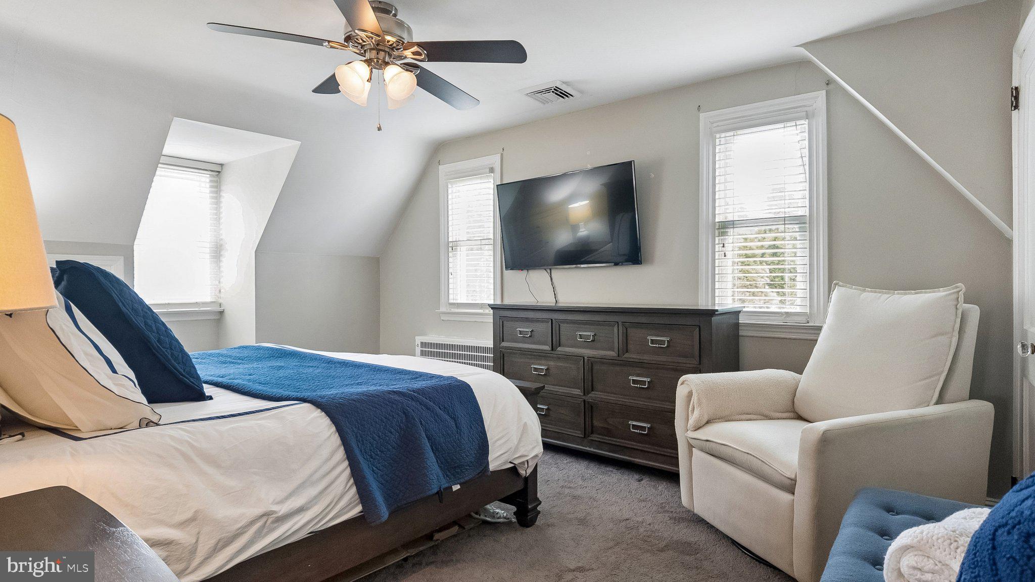629 Willowbrook Road Havertown, PA 19083 - Photo 20 of 33 a bedroom with a bed a couch and a flat screen tv