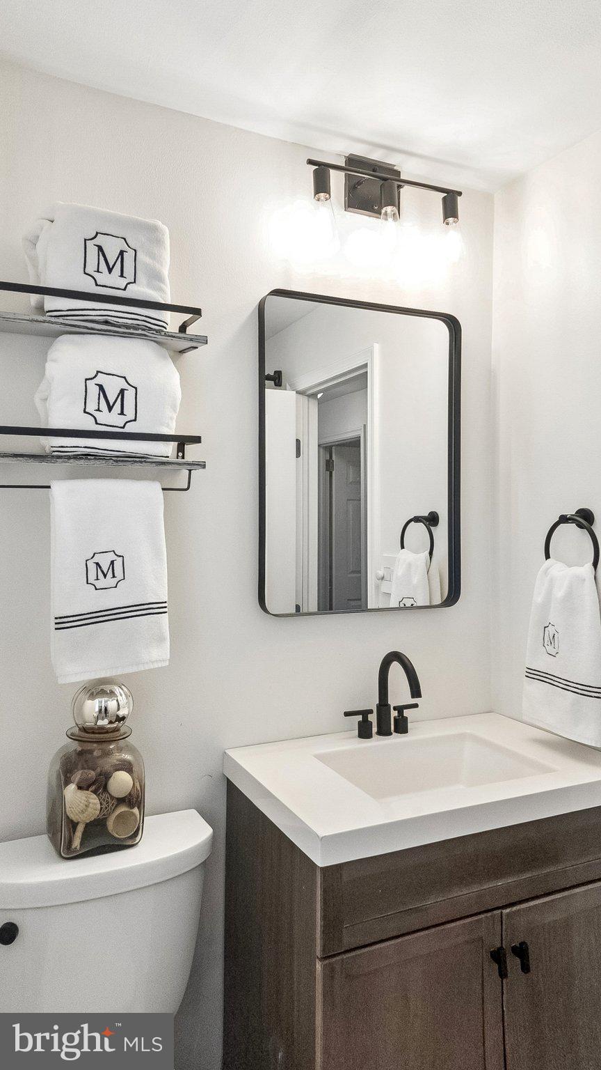 629 Willowbrook Road Havertown, PA 19083 - Photo 24 of 33 a bathroom with a toilet sink and mirror