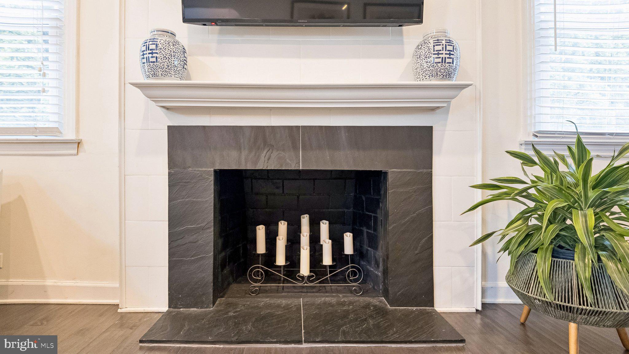 629 Willowbrook Road Havertown, PA 19083 - Photo 8 of 33 a living room with a fireplace and wooden floor