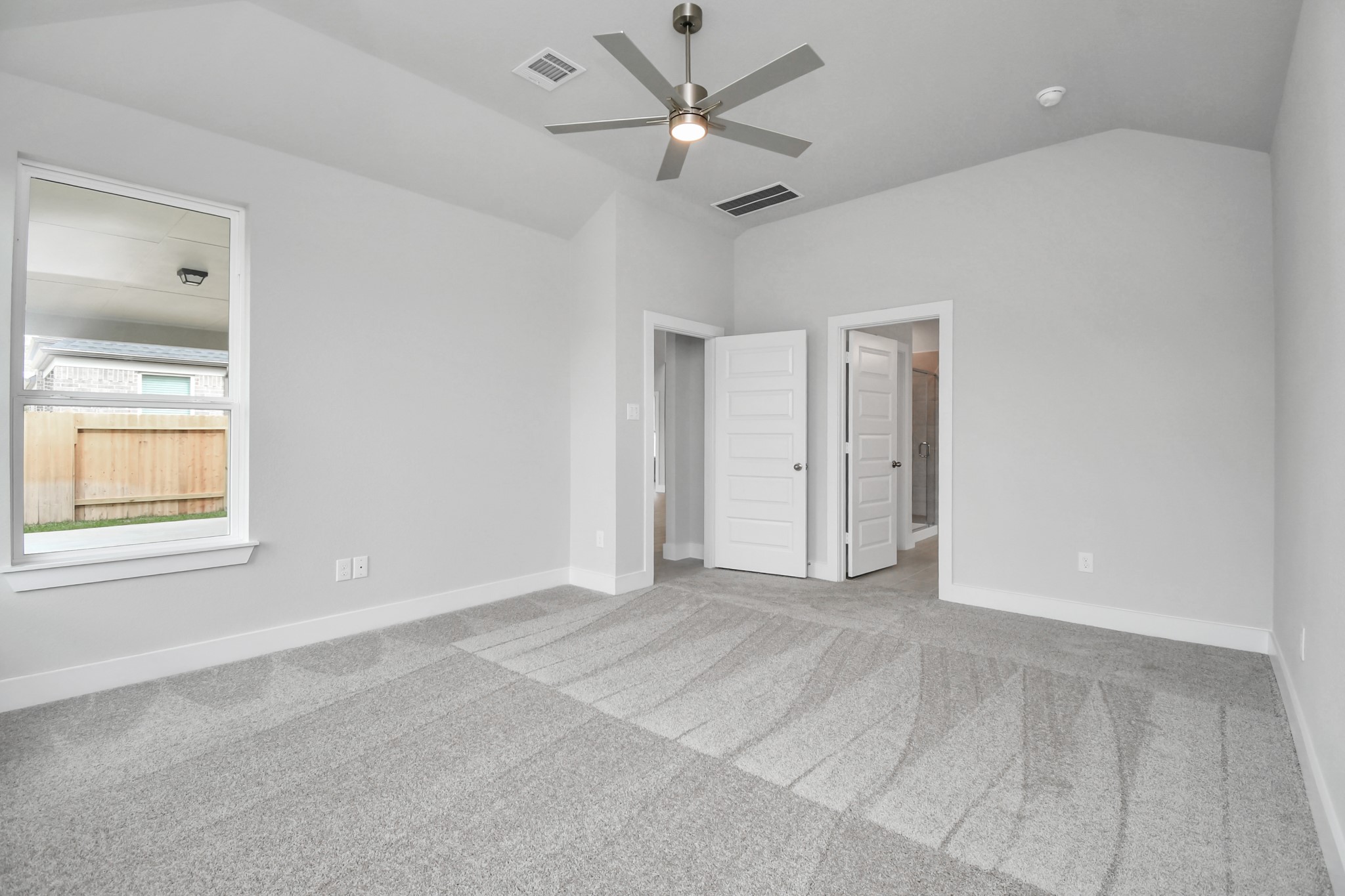 3043 Native Spg Drive Spring, TX 77373 - Photo 24 of 39 Come and unwind after a long day in this magnificent primary suite! This spacious room features plush carpet, warm paint, high ceilings and large windows with privacy blinds. Sample photo of completed home with similar floor plan. Actual colors and selections may vary.