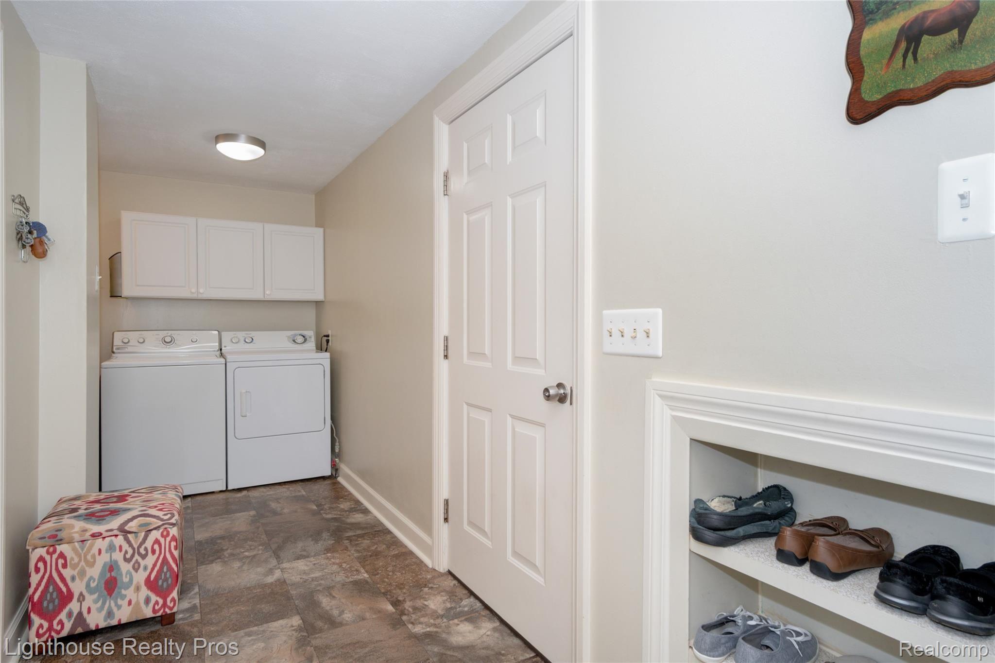 8773 Hyne Road Brighton, MI 48114 - Photo 16 of 38 Laundry/mud room with built ins and more storage around the corner