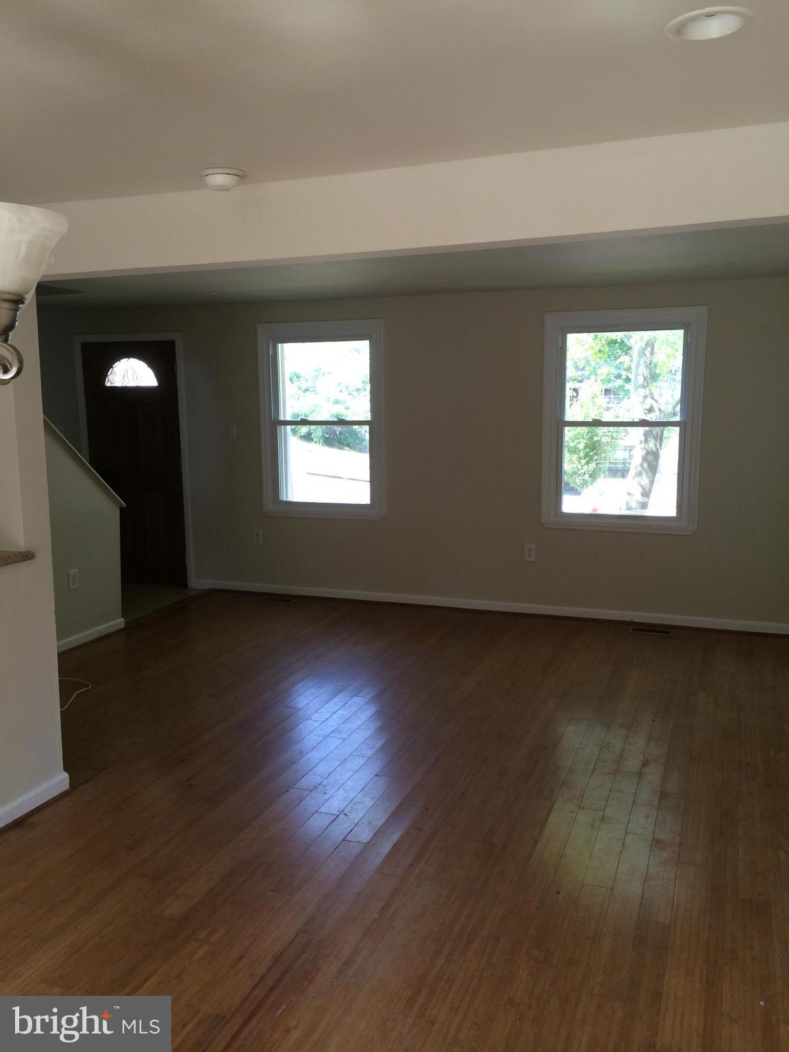 3513 Chado Road Clinton, MD 20735 - Photo 4 of 6 an empty room with wooden floor and windows