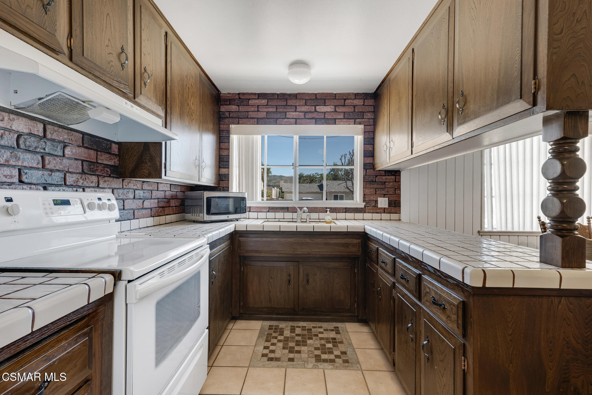 3493 Amarillo Avenue Simi Valley, CA 93063 - Photo 14 of 49 a kitchen with stainless steel appliances granite countertop a sink stove and cabinets