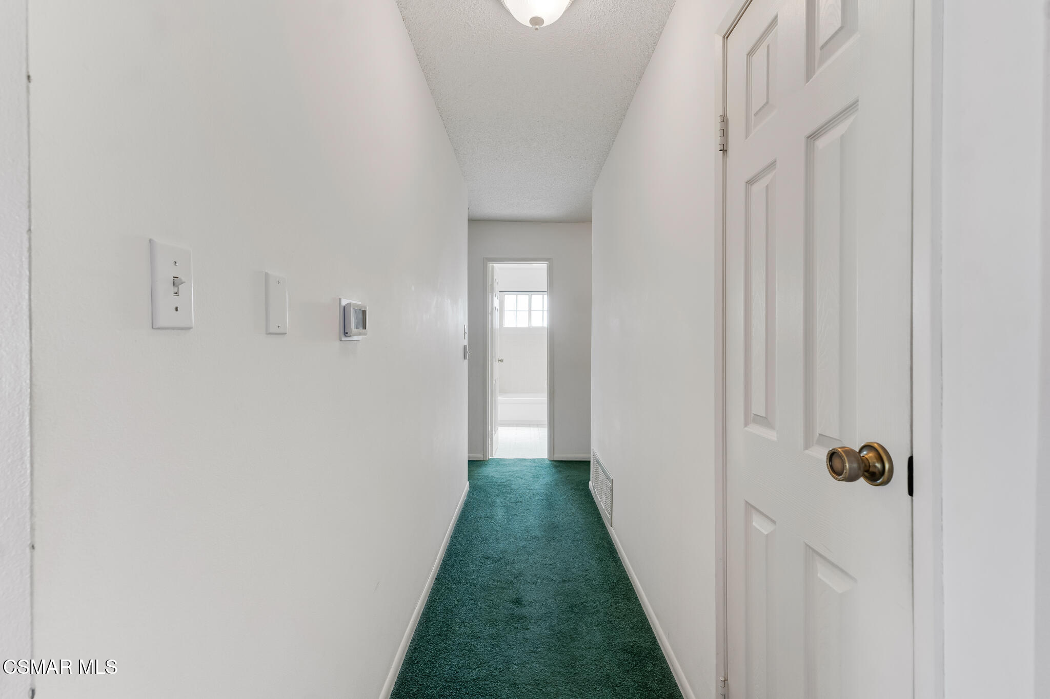 3493 Amarillo Avenue Simi Valley, CA 93063 - Photo 19 of 49 a view of a hallway with a white walls