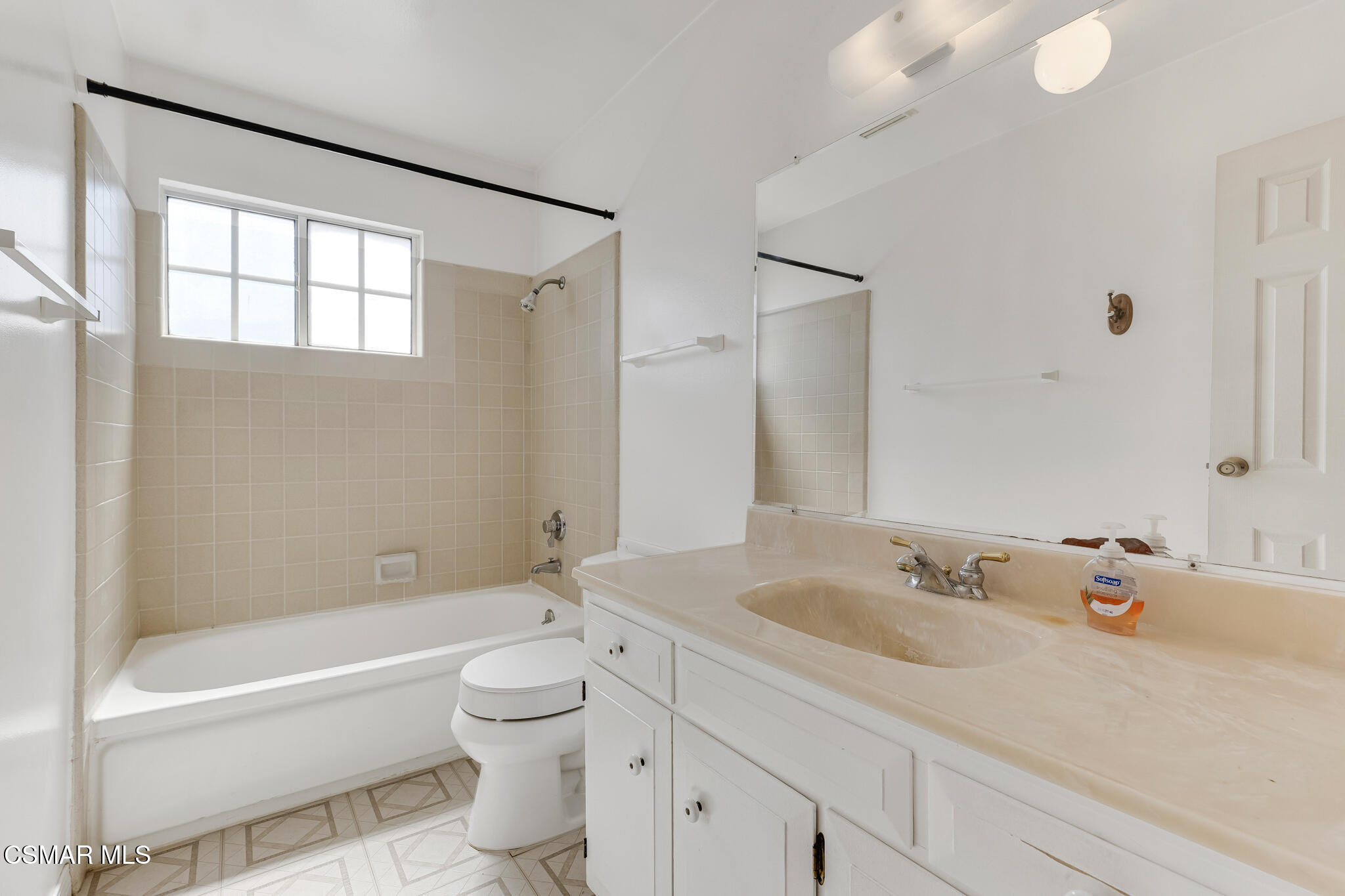 3493 Amarillo Avenue Simi Valley, CA 93063 - Photo 20 of 49 a bathroom with a bathtub shower sink vanity mirror and toilet