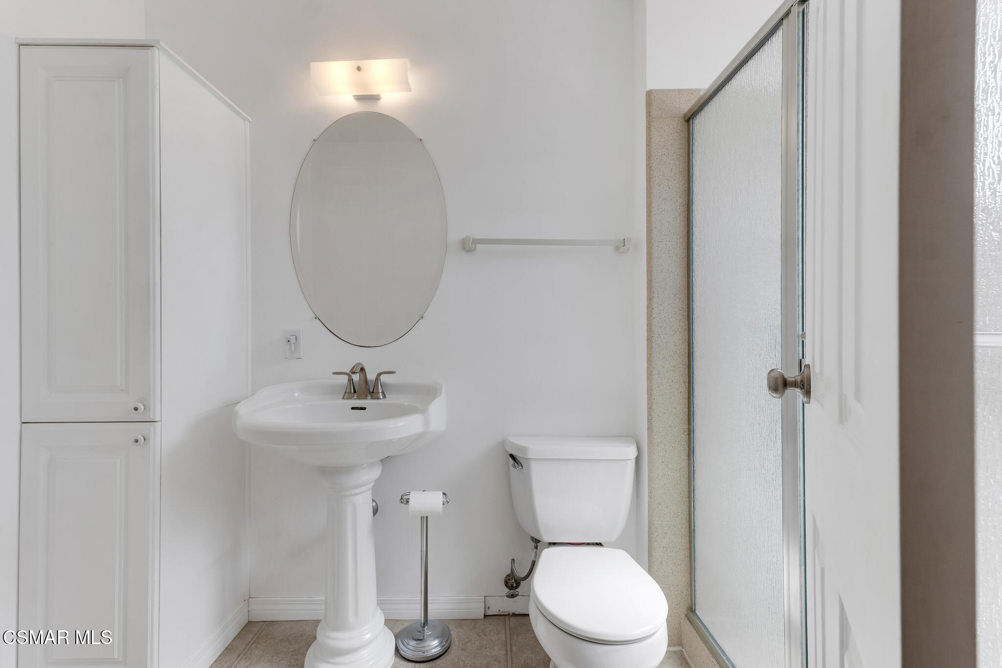 3493 Amarillo Avenue Simi Valley, CA 93063 - Photo 31 of 49 a bathroom with a toilet a sink and mirror