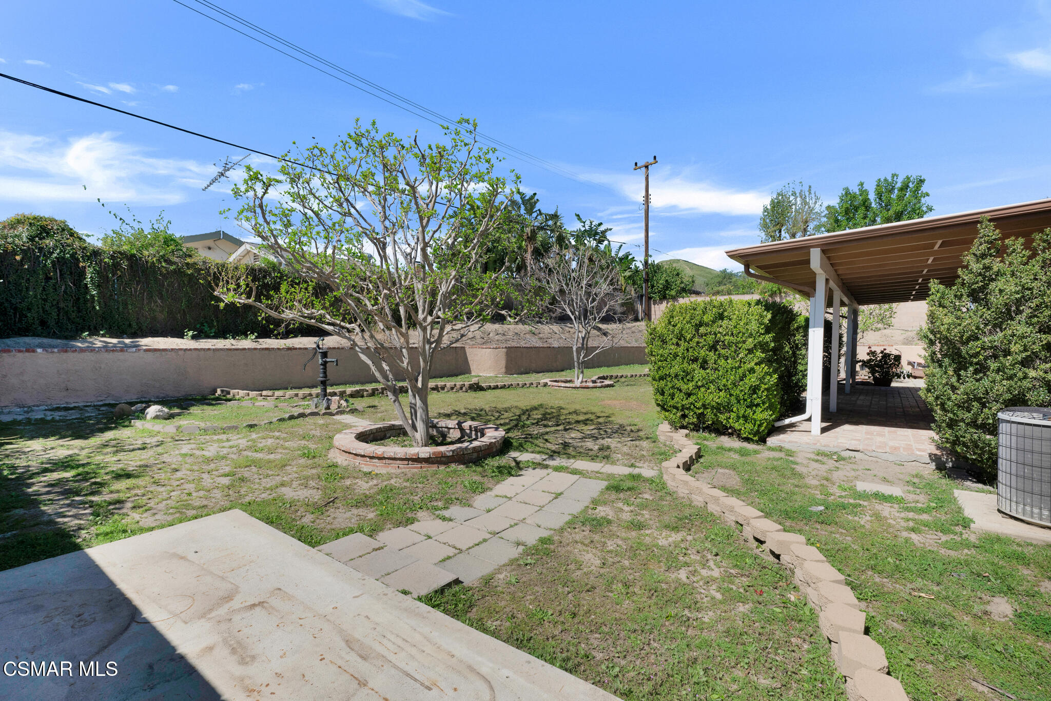 3493 Amarillo Avenue Simi Valley, CA 93063 - Photo 36 of 49 a view of a backyard with plants and a patio
