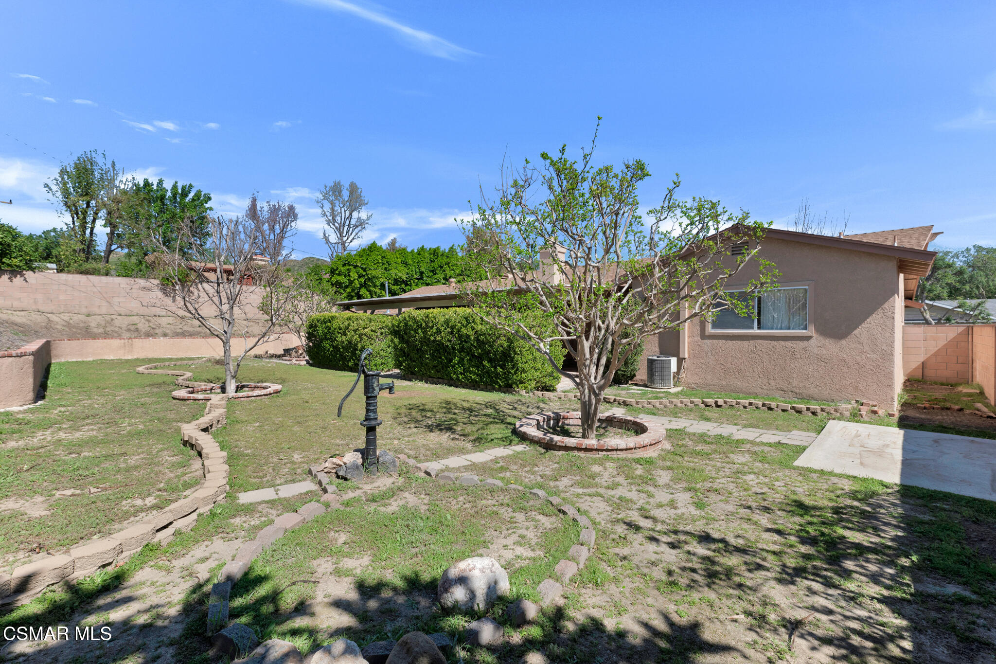 3493 Amarillo Avenue Simi Valley, CA 93063 - Photo 38 of 49 a view of a fountain in front of a house