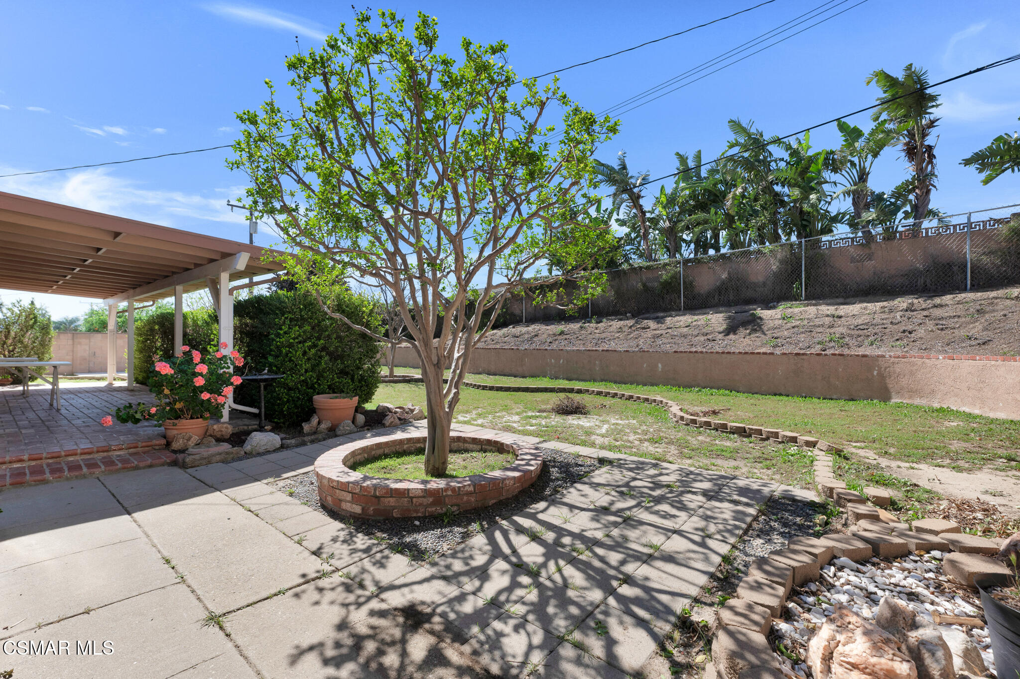 3493 Amarillo Avenue Simi Valley, CA 93063 - Photo 41 of 49 a view of a backyard with plants and a patio