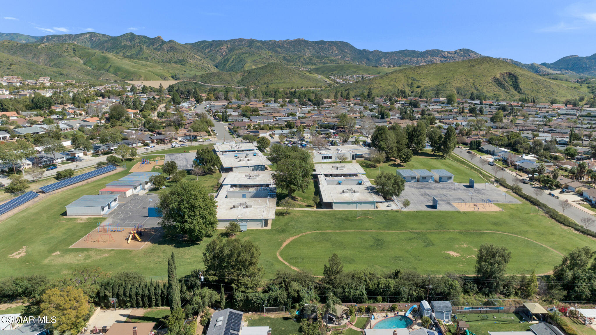 3493 Amarillo Avenue Simi Valley, CA 93063 - Photo 46 of 49 an aerial view of a town with swimming pool and mountains