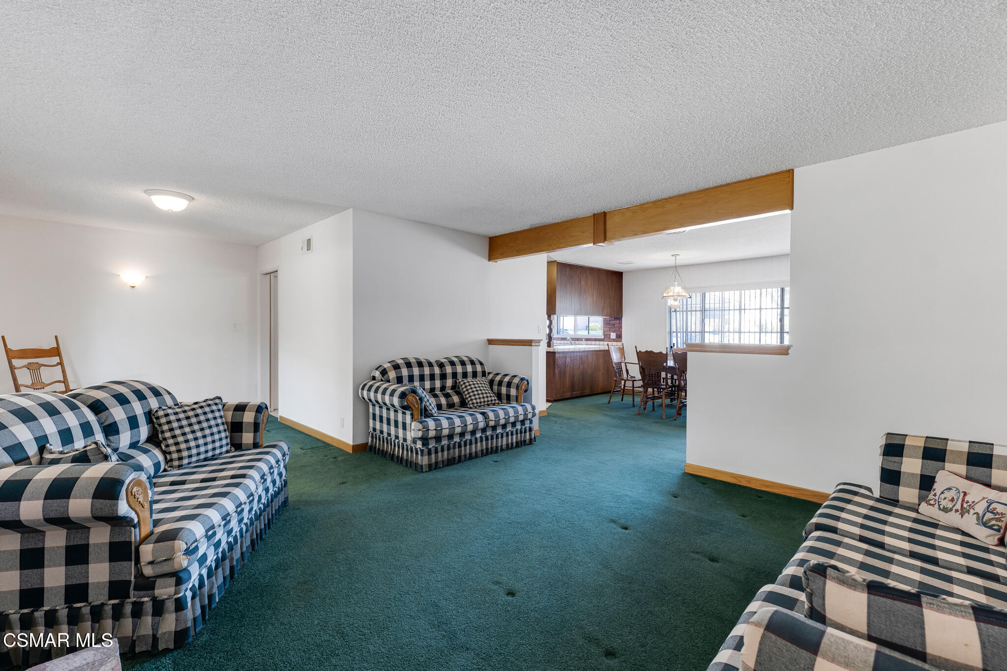 3493 Amarillo Avenue Simi Valley, CA 93063 - Photo 8 of 49 a living room with furniture and a rug