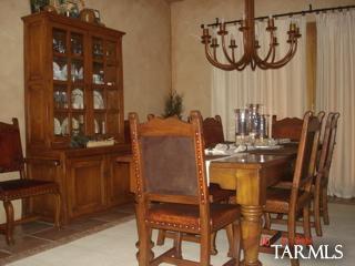 12222 Cloud Ridge Drive Tucson, AZ 85755 - Photo 3 of 10 a view of a dining room with furniture and chandelier
