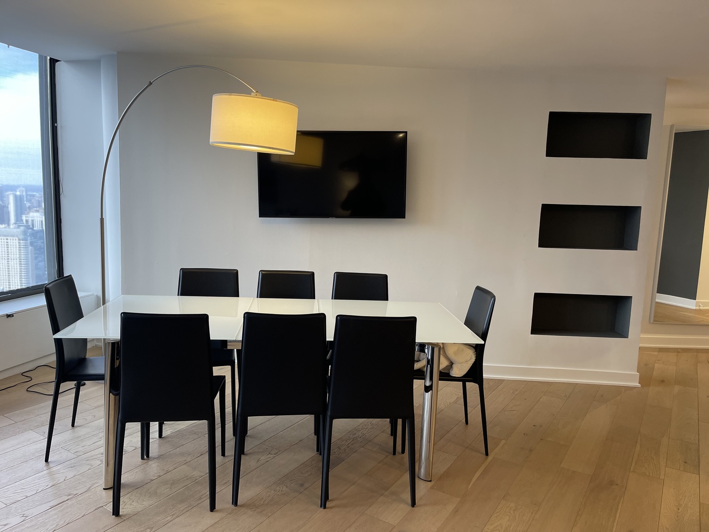 505 North Lake Shore Drive, Unit 5701 Chicago, IL 60611 - Photo 11 of 27 a view of a dining room with furniture and wooden floor