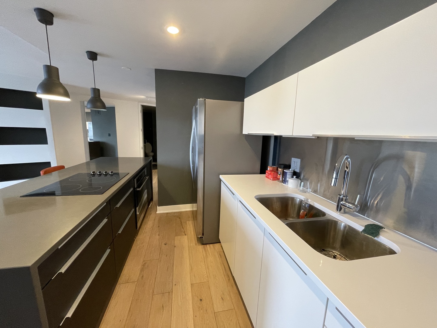 505 North Lake Shore Drive, Unit 5701 Chicago, IL 60611 - Photo 13 of 27 a kitchen with a sink a counter top space a stove and refrigerator