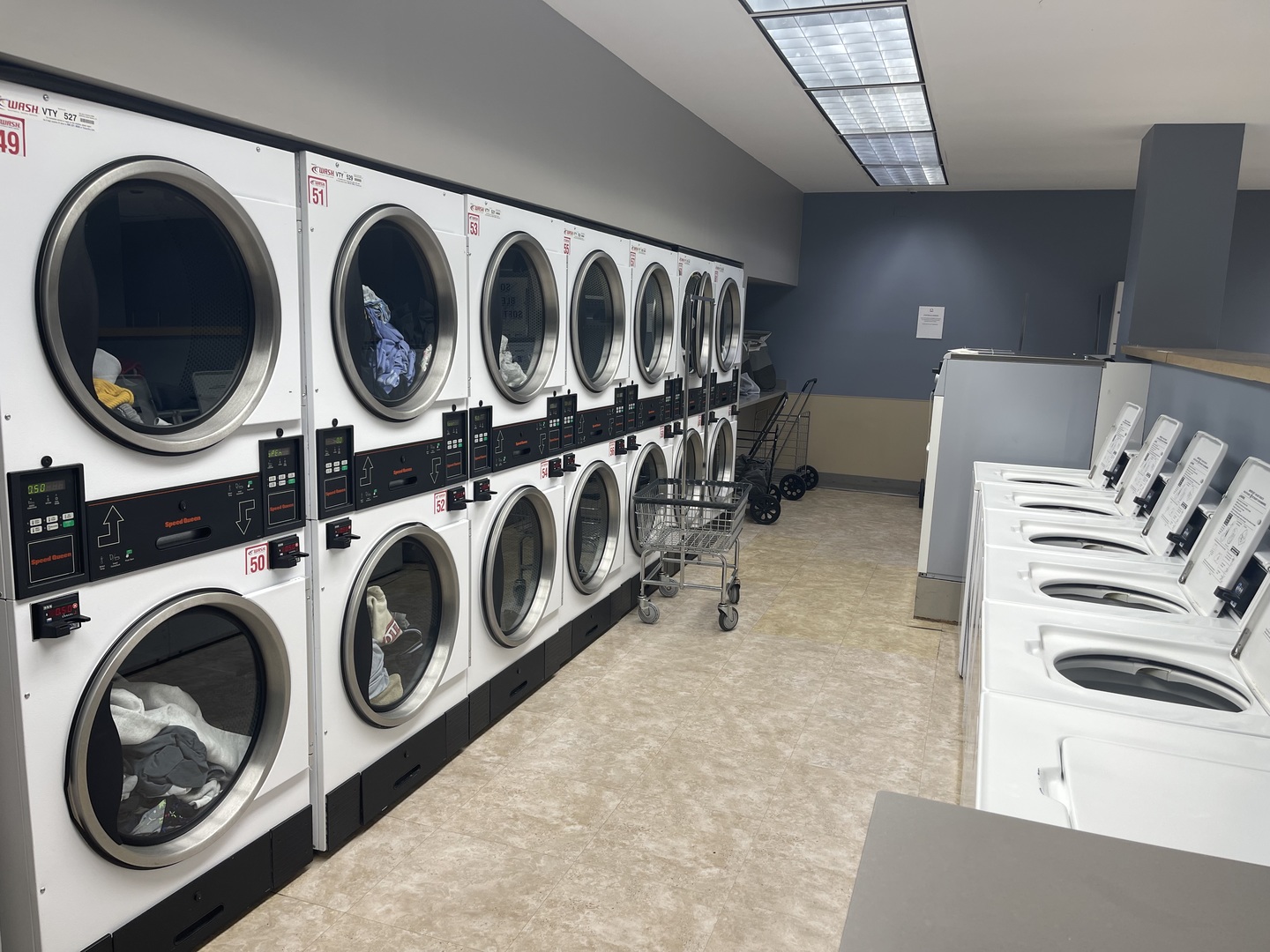 505 North Lake Shore Drive, Unit 5701 Chicago, IL 60611 - Photo 25 of 27 a utility room with dryer and washer