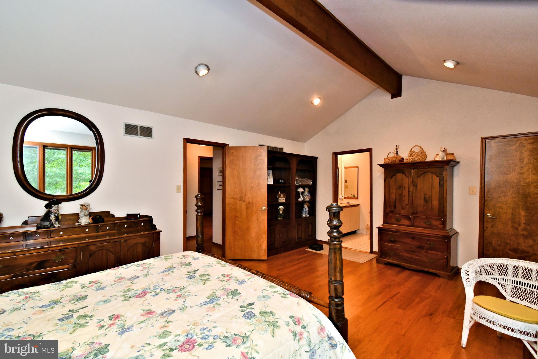 179 Almshouse Road Doylestown, PA 18901 - Photo 28 of 68 a bedroom with a bed and a large window
