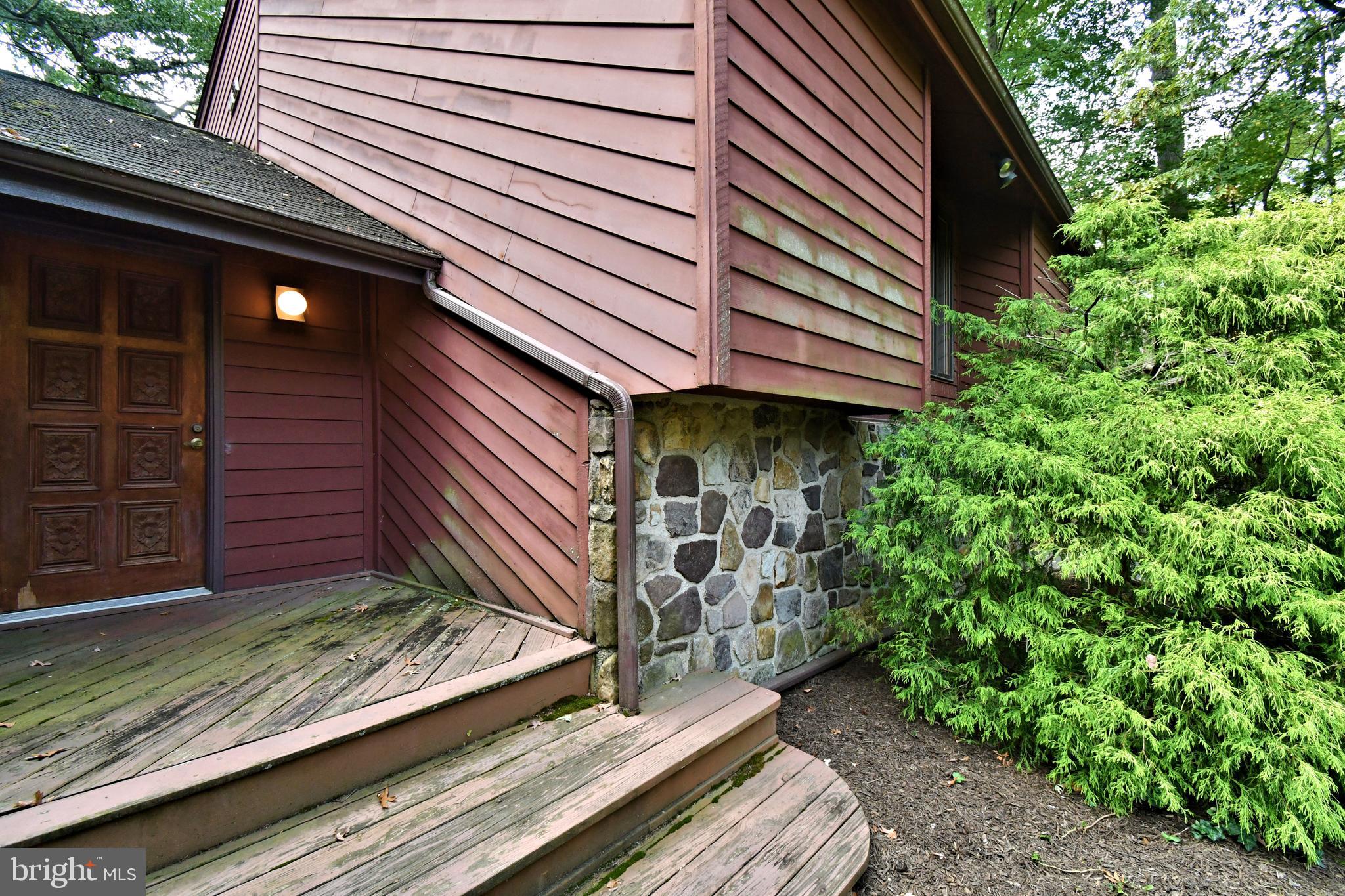 179 Almshouse Road Doylestown, PA 18901 - Photo 6 of 68 a view of a backyard with plants and large tree