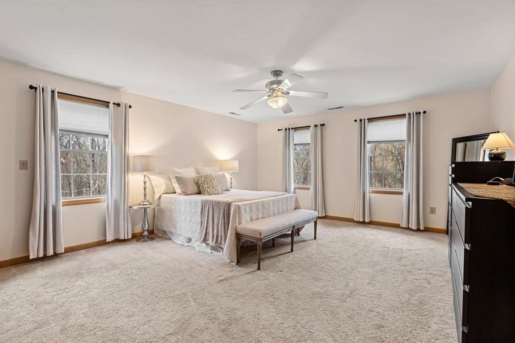 15 Lamb Road Nashua, NH 03062 - Photo 18 of 40 a spacious bedroom with a bed closet and a window
