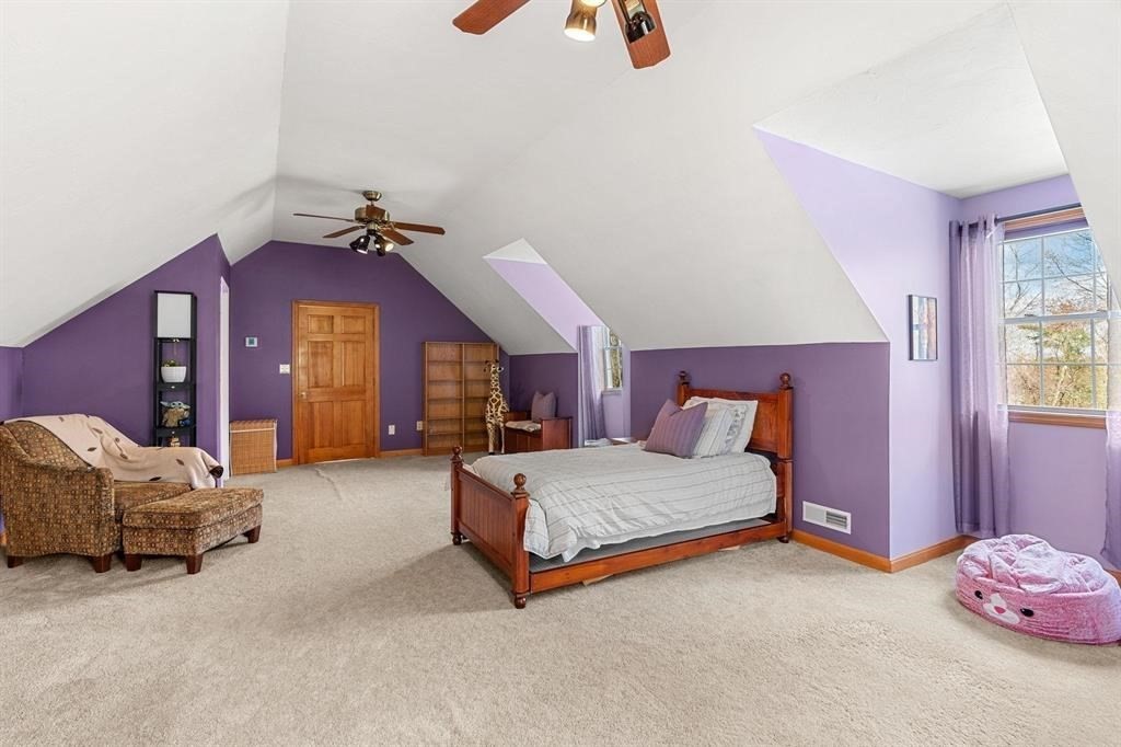 15 Lamb Road Nashua, NH 03062 - Photo 29 of 40 a spacious bedroom with a bed and a couch