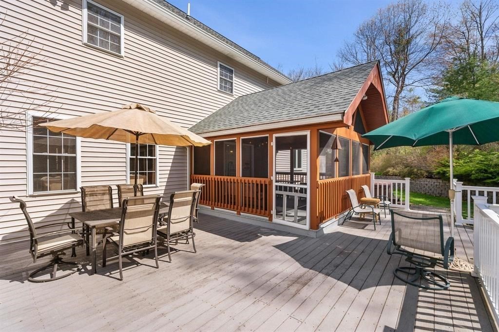 15 Lamb Road Nashua, NH 03062 - Photo 38 of 40 a patio with table and chairs