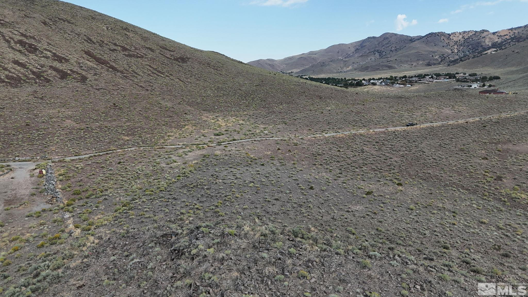 0 Desert Way Reno, NV 89502 - Photo 12 of 27 a view of a dry field with mountains in the background