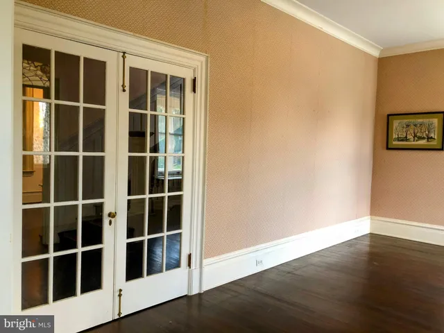a view of a room window and wooden floor