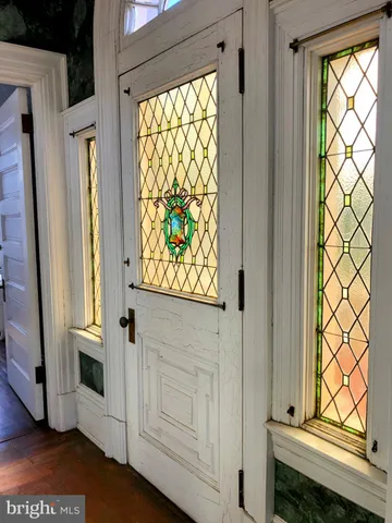 a view of a porch with wooden floor