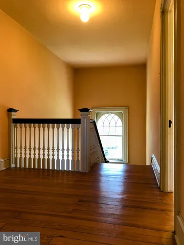 a view of yard with swimming pool and green space