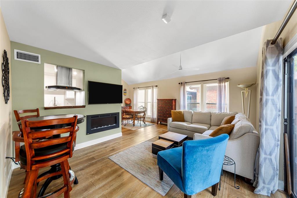 4211 Prescott Avenue, Unit 5 Dallas, TX 75219 - Photo 12 of 38 At top of stairs, Living area with fireplace