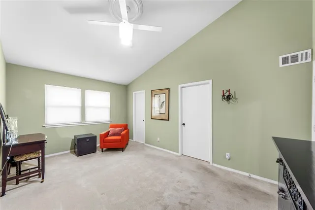 a living room with furniture a window and a chandelier