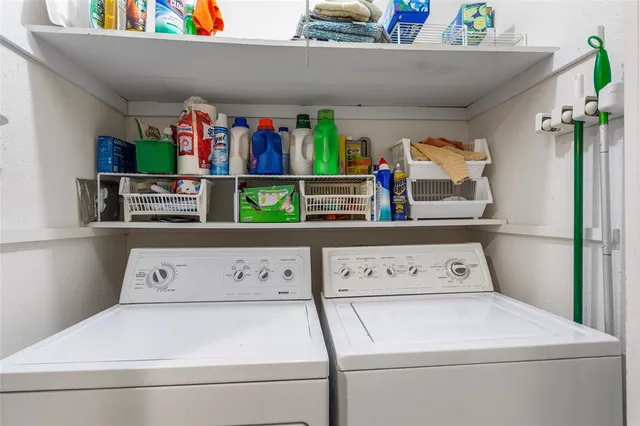 a utility room with washer and dryer