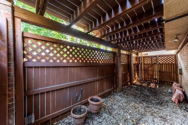 a view of a porch with wooden floor